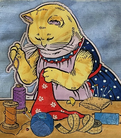 裁縫をする母猫